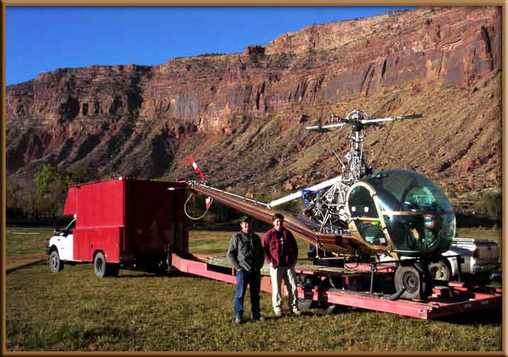 Prepairing helicopter to be loaded on trailer.